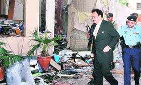 Pakistan’s Minister Rehman Malik at the blast site