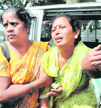 The grieving wife of the slain cop in Ranchi on Tuesday.