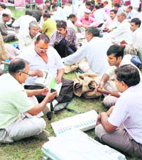 Poll officials inspect EVMs in Gurgaon on the eve of Assembly elections on Monday.