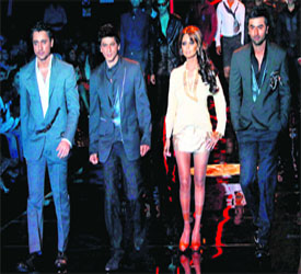 Bollywood actors Imran Khan (L) and Ranbir Kapoor (R) walk the ramp with Shahrukh Khan and his wife Gauri displaying creations of Karan Johar with Varun Bahl during the India Couture Fashion Week in Mumbai on Friday night.