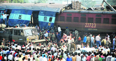Onlookers at the site of the train accident on the outskirts of Mathura