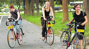 These three cyclists enjoy a ride on their bikes near Leisure Valley-10.