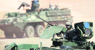 A US army soldier sits atop a combat vehicle during a joint Indo-US training exercise in Babina, Uttar Pradesh