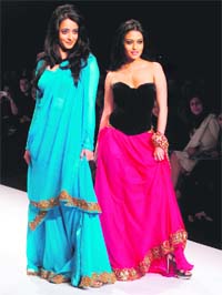 SISTER ACT: Bollywood actress Raima and Ria Sen showcasing designer Sanjana Jon during the Wills Life Style fashion week in New Delhi