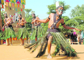 Artiste from Gujarat flaunt their peacock feathers during a folk dance performance at the ongoing Natoinal Crafts Mela at Kalagram.