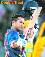 Sachin Tendulkar celebrates after scoring his 45th ODI century in Hyderabad on Thursday. He became the first batsman ever to score 17,000 runs in ODIs. Australia won by 3 runs.