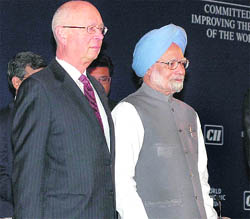 Prime Minister Manmohan Singh along with Klaus Schwab, the founder and executive chairman of World Economic Forum, at the 25th India Economic Summit in New Delhi on Sunday.