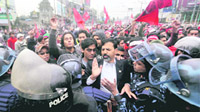 Policemen stop supporters of the former rebel Communist Party of Nepal (Maoists) from proceeding onwards during a demonstration in Kathmandu on Thursday.