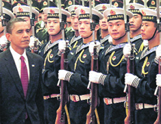 US President Barack Obama reviews the guard of honour in Beijing on Tuesday.