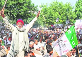 Sugarcane farmers hold a protest demanding a higher support price for their produce in New Delhi