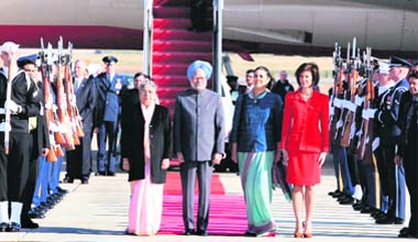 Prime Minister Manmohan Singh and his wife Gursharan Kaur arrive at the Andrews Air Force Base, Maryland, in Washington on Sunday. Also seen in the picture is Indian Ambassador to the US Meera Shankar.