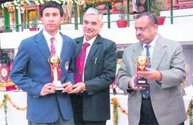 Best sportsman being honoured by school authorities