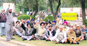 Employees of the Punjab Government Pensioners’ Welfare Association stage a dharna outside a mini secretariat