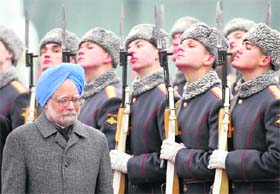 Prime Minister Manmohan Singh reviews the guard of honour shortly after his arrival at Vnukovo II airport outside Moscow