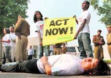 Greenpeace activists protest outside the US Embassy demanding action from world leaders to save deal at Copenhagen, in New Delhi on Thursday.