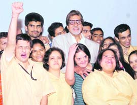 Bollywood Actor Amitabh Bachchan poses with underprivilege kids during the premiere of film Paa in Mumbai on Saturday.