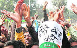 Angry cricket fans raise slogans against the DDCA outside Ferozeshah Kotla Stadium in New Delhi on Sunday.