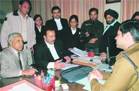 Complainant in the Ruchika molestation case Anand Parkash (extreme left) files a fresh complaint with SSP Mahesh Chaudhary in Panchkula