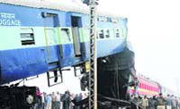 Rescue workers examine the wreckage at Etawah.