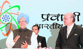 Prime Minister Manmohan Singh gestures as chief guest Lord Khalid Hameed of Hampstead looks on during the inaugural session of 8th Pravasi Bharatiya Divas at Vigyan Bhawan in New Delhi on Friday.