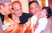 President Pratibha Patil administers polio vaccines to a kid to inaugurate the National Immunisation Day at Rashtrapati Bhawan in New Delhi on Saturday. Health Minister Ghulam Nabi Azad and MoS Dinesh Trivedi can also be seen in the picture. 