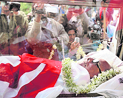 The body of Jyoti Basu is brought to his residence in Kolkata on Sunday.