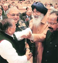 SP chief Mulayam Singh Yadav greets Punjab CM Parkash Singh Badal as Haryana CM Bhupinder Singh Hooda and Law Minister Veerappa Moily look on at the diamond jubilee celebrations of Election Commission of India in New Delhi