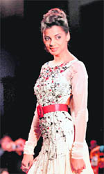 Actor Mughda Godse walks the ramp presenting the creation of designer Swapnil Shinde during the Blenders Pride Bangalore Fashion Week in Bangalore