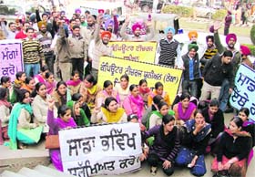 Computer teachers hold a rally in support of their demands in Ludhiana