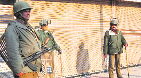 CRPF personal stand guard in Srinagar on Thursday.