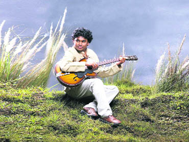 Composer A. R. Rahman plays his guitar at a hill station