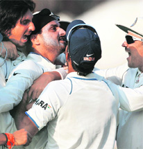 Harbhajan Singh (C) celebrates with teammates after India won the second Test against South Africa in Kolkata on Thursday. India drew the series 1-1 with an innings and 58-run win on the last day with just about four overs left. Harbhajan was the star with a five-wicket haul and South Africas Hashim Amla, who was declared Man of the Match and Man of the series, scored his third ton (127 n.o.) of the series.