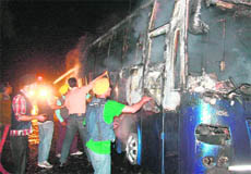 Agitators torch a PRTC bus in Bathinda on Saturday.