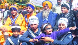Sikh boys in their traditional gear pose for the camera.