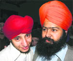 Pakistani Sikh Gurendal Singh (left) is received by a family member after his release in Peshawar