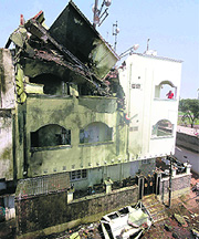 The damage caused to a residential building after a Navy aircraft crashed in Hyderabad on Wednesday. 
