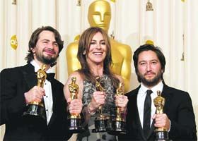 (From left): Screen writer Mark Boal, director Kathryn Bigelow and producer Greg Shapiro pose backstage with their Oscars for screen writing, directing and best movie for 'The Hurt Locker' at the 82nd Academy Awards