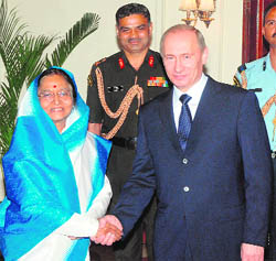 President Pratibha Patil with Russian Prime Minister Vladimir Putin in New Delhi on Friday.