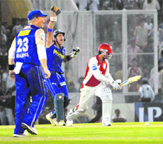 Rajasthan Royals skipper Shane Warne and wicketkeeper Naman Ojha appeal against Kings XIs Mohd Kaif at the PCA Stadium in Mohali on Wednesday. Royals won the match by 31 runs.