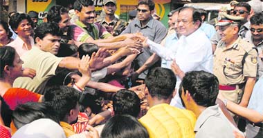 Union Home Minister P Chidambaram shakes hands with villagers during a visit to Lalgarh, some 130 km west of Kolkata