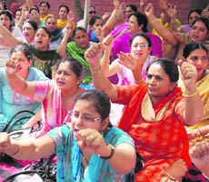 Government school teachers protest in Sector 19, Chandigarh, on Friday.