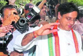 Shashi Tharoor being hounded by the media at Parliament House in New Delhi