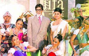 Bollywood actor and ambassador for the International Indian Film Academy (IIFA) awards Amitabh Bachchan with Sri Lankan actor Jacqueline Fernandez and traditional dancers during the media launch of the 11th awards in Colombo on Tuesday.
