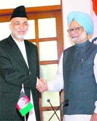 Prime Minister Manmohan Singh with Afghan President Hamid Karzai in New Delhi