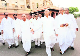 Samajwadi Party chief Mulayam Singh Yadav (3rd L) and RJD supremo Lalu Prasad (3rd R) come out of Parliament House in New Delhi on Tuesday.