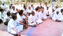 Congress general secretary Rahul Gandhi (fourth from left) offers condolences to victims of Dalit violence in Mirchpur village near Hisar on Thursday.