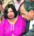 Madhuri Gupta is escorted after making an appearance at Tees Hazari court in New Delhi.