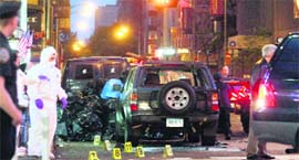 Police checks the SUV in which a crude bomb was found.