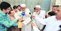 Local man Nazirullah speaks to the media in Shahzads ancestral village