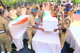 Paramilitary personnel inspect the site where Naxals blew up a bulletproof vehicle killing eight CRPF jawans in Bijapur